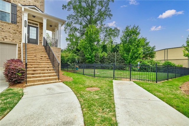 view of yard with stairway and a garage
