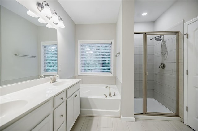 full bath featuring a stall shower, a bath, and double vanity