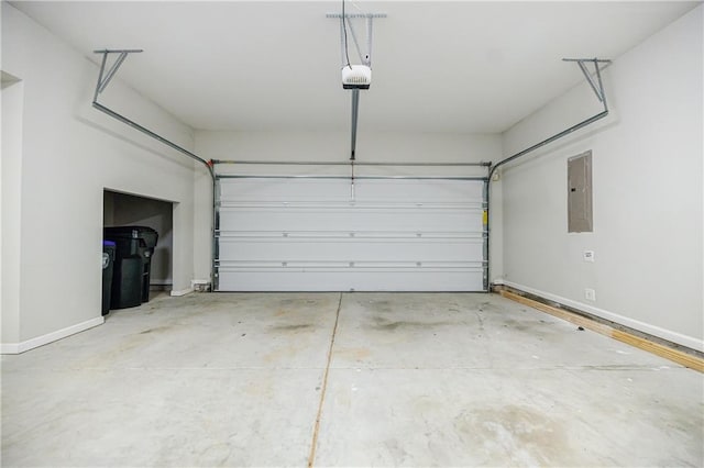 garage with electric panel, baseboards, and a garage door opener
