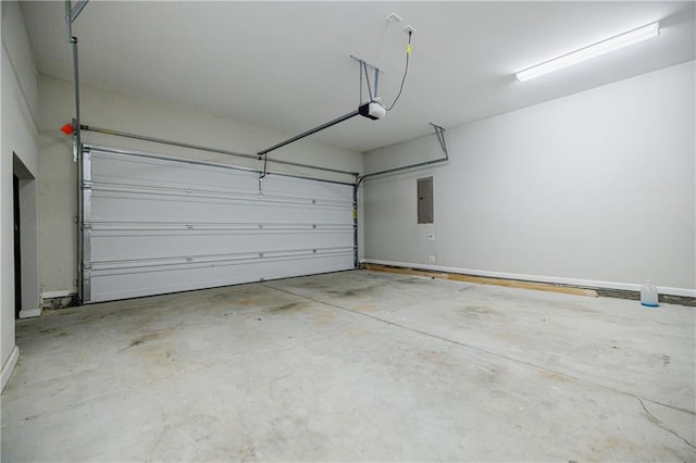 garage with electric panel and a garage door opener
