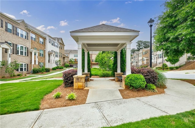 surrounding community featuring a residential view and a lawn