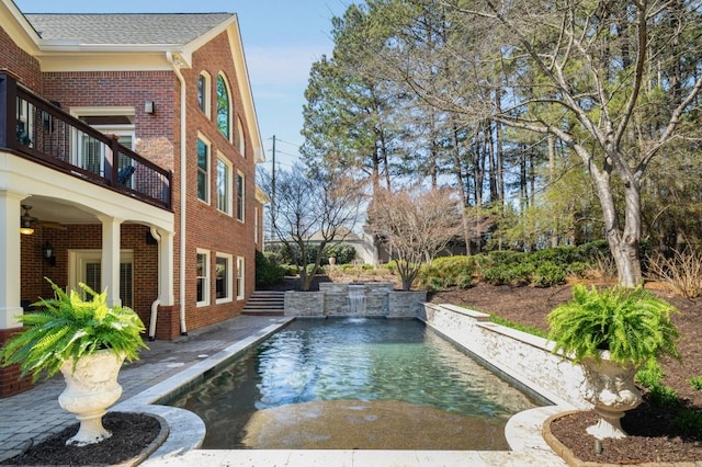 outdoor pool featuring a patio