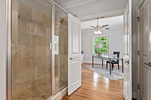 bathroom with an enclosed shower, crown molding, ceiling fan, and hardwood / wood-style flooring