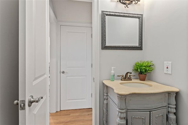 bathroom with vanity and hardwood / wood-style flooring