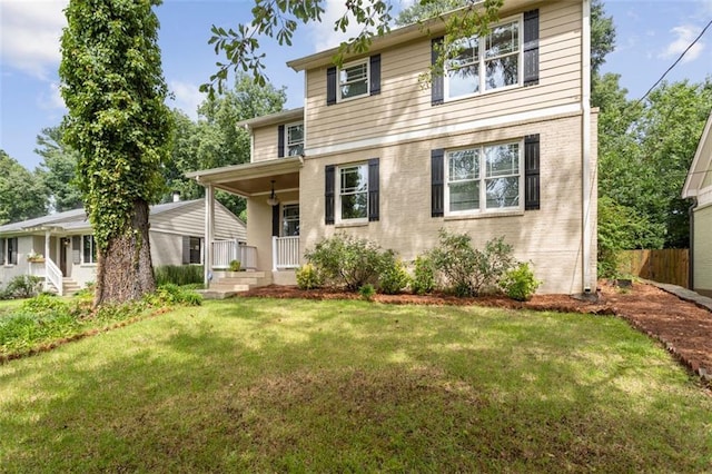 view of front of house featuring a porch and a front yard