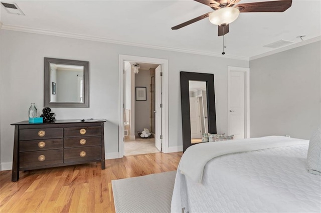 bedroom featuring ornamental molding, connected bathroom, ceiling fan, and light wood-type flooring