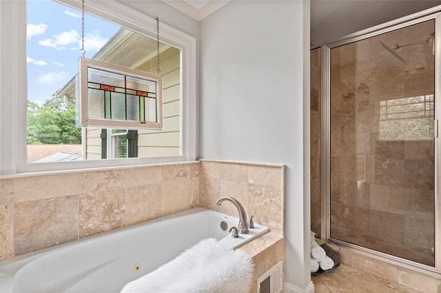 bathroom featuring separate shower and tub