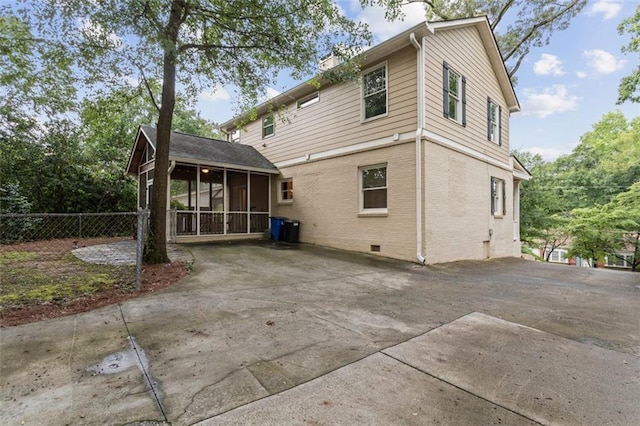 back of property with a patio