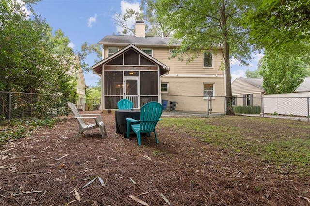 back of property featuring a sunroom