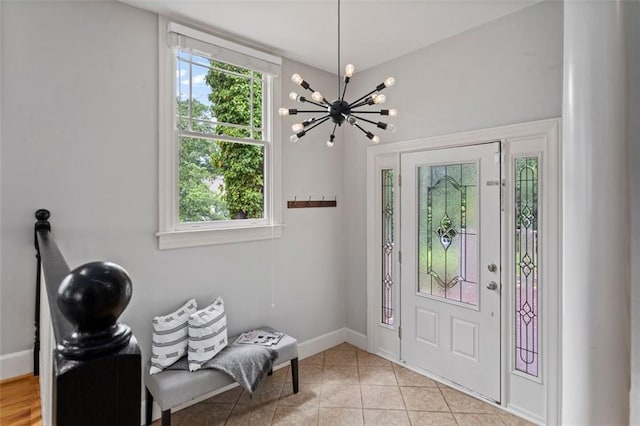 entrance foyer with a notable chandelier and light tile floors