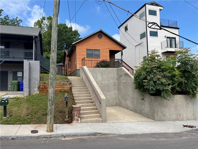 view of front of house featuring stairs
