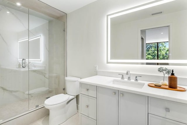 full bath featuring vanity, toilet, visible vents, and a marble finish shower