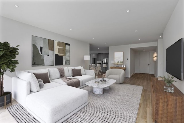 living room featuring recessed lighting and light wood-style flooring