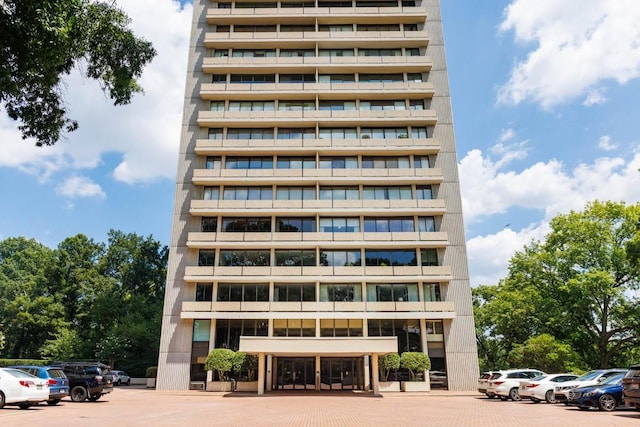 view of property featuring uncovered parking