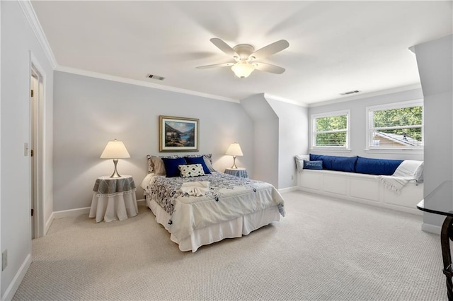 carpeted bedroom featuring ceiling fan and crown molding