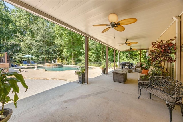 view of patio / terrace with ceiling fan and pool water feature