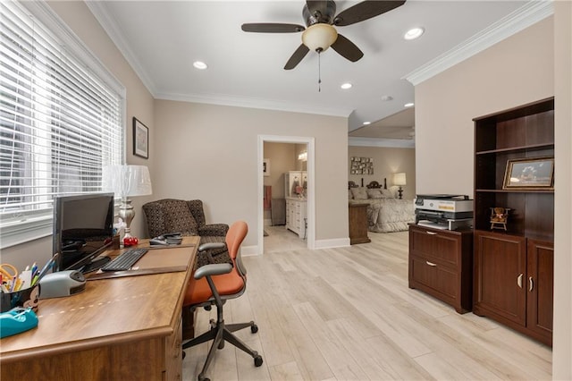 office area featuring ceiling fan, ornamental molding, and light wood-type flooring