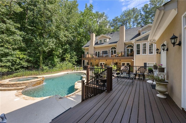 view of swimming pool with a patio area and an in ground hot tub