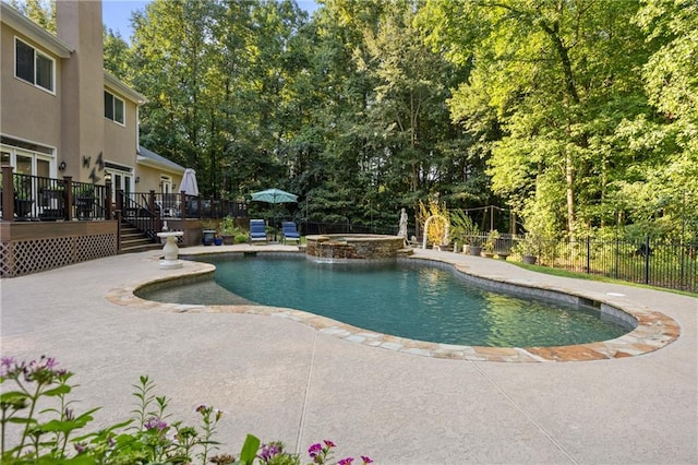 view of swimming pool featuring a patio area and a deck