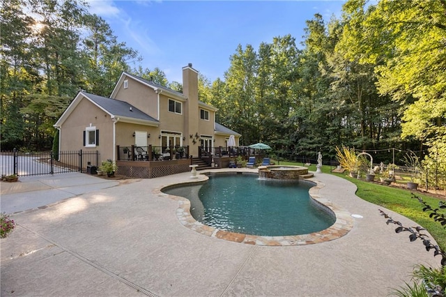 view of pool with a deck, an in ground hot tub, and a patio