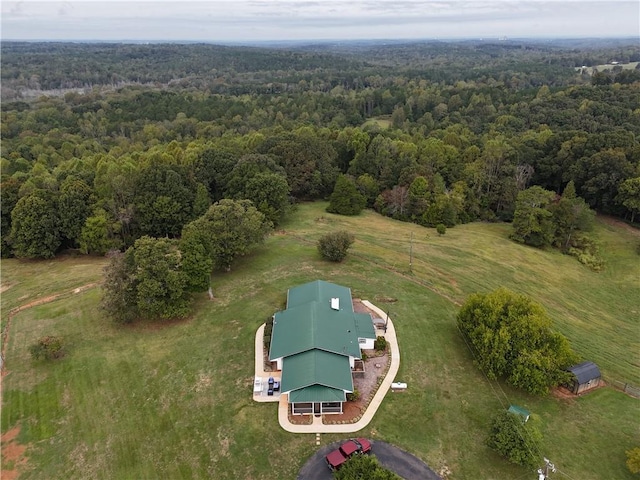 birds eye view of property with a rural view