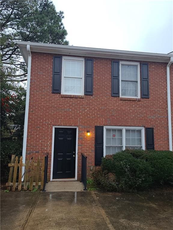 view of front of home with brick siding