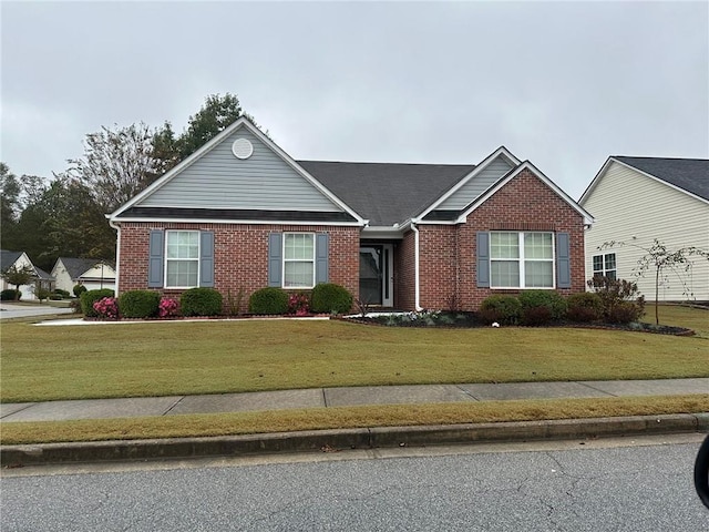 ranch-style house featuring a front lawn