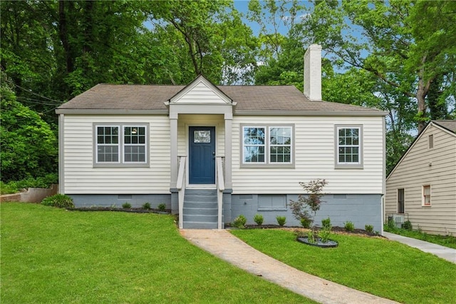 view of front of home featuring a chimney, roof with shingles, a front lawn, and crawl space