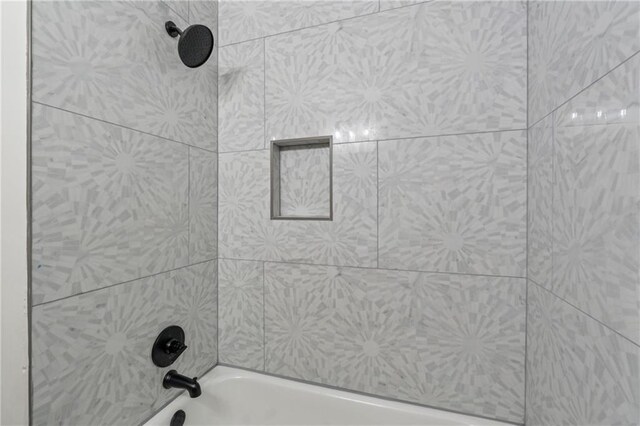 bathroom with shower / tub combination