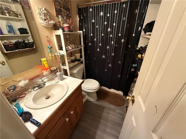 135 Woodcrest Dr, Covington, GA 30016 - bathroom featuring vanity, a shower with curtain, and wood finished floors