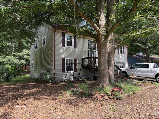 135 Woodcrest Dr, Covington, GA 30016 - view of front of home featuring a garage and stairs