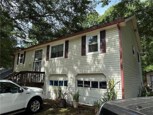 135 Woodcrest Dr, Covington, GA 30016 - raised ranch featuring a garage and driveway