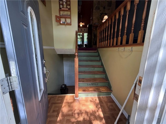 135 Woodcrest Dr, Covington, GA 30016 - stairs featuring a ceiling fan and baseboards