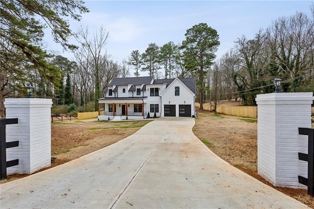 view of front of property with a garage and covered porch