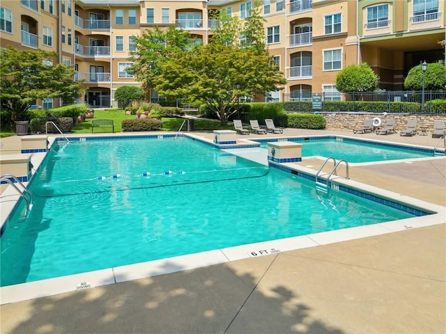 view of swimming pool featuring a patio