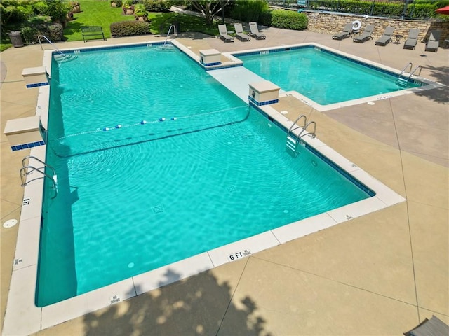 view of pool featuring a patio