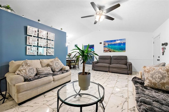 living room featuring lofted ceiling, marble finish floor, and a ceiling fan