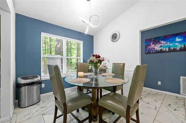dining area featuring visible vents, baseboards, and marble finish floor