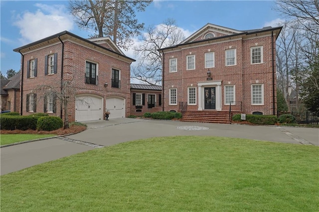 view of front of home featuring a front yard and a garage