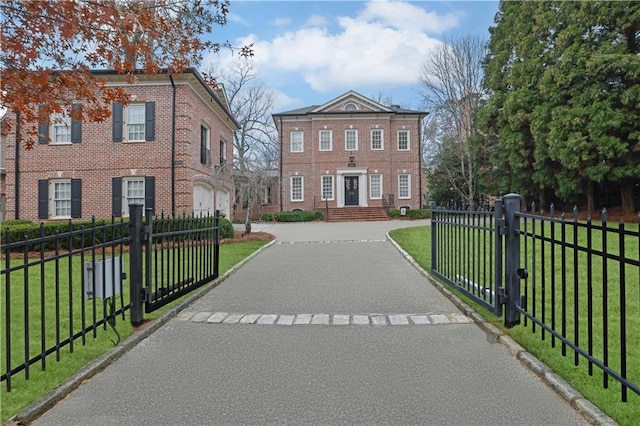 view of front of house with a front lawn and a garage