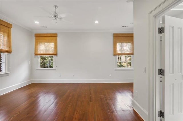 unfurnished room with crown molding, ceiling fan, and dark wood-type flooring