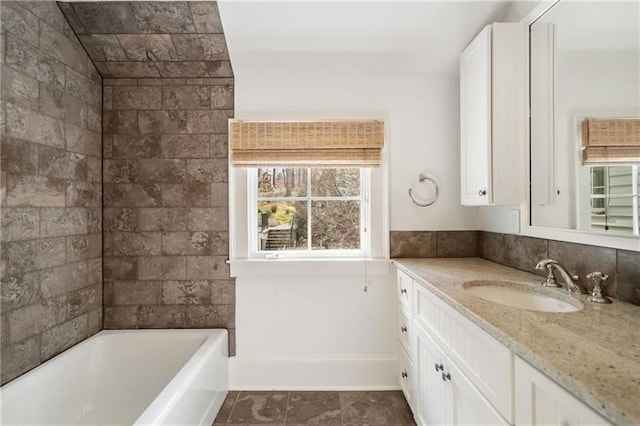 bathroom with vanity and a wealth of natural light