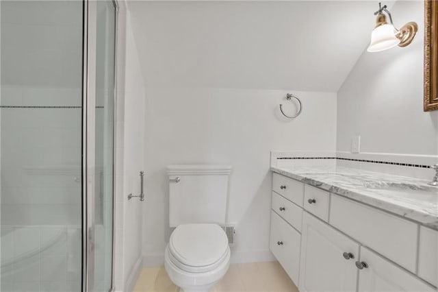 bathroom with vanity, an enclosed shower, vaulted ceiling, and toilet