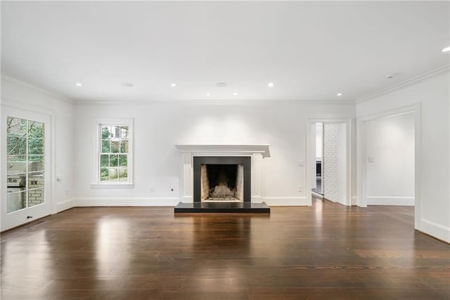 unfurnished living room with crown molding and dark hardwood / wood-style floors