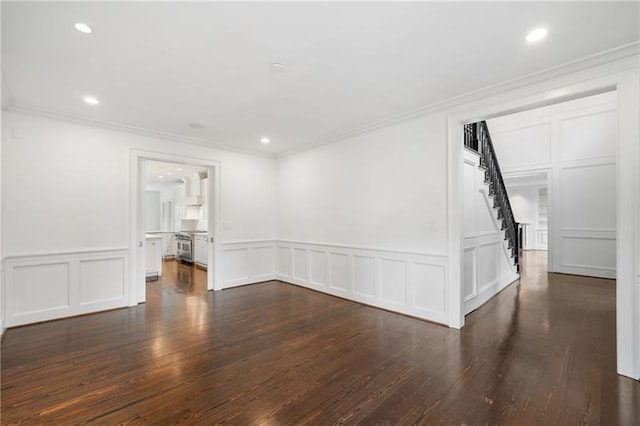 unfurnished room featuring crown molding and dark wood-type flooring