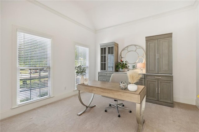 carpeted office space with crown molding and lofted ceiling