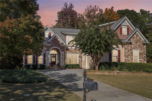 craftsman-style house with a yard