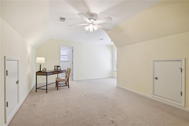 carpeted home office with lofted ceiling and ceiling fan