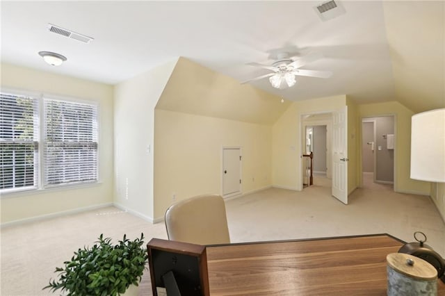 home office featuring vaulted ceiling, light carpet, and ceiling fan