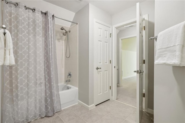 bathroom featuring tile patterned floors and shower / tub combo with curtain